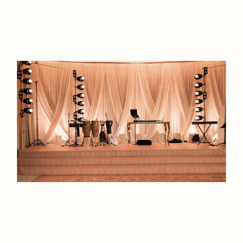 Criss cross drapery stage backdrop rental from Palace Party Rental