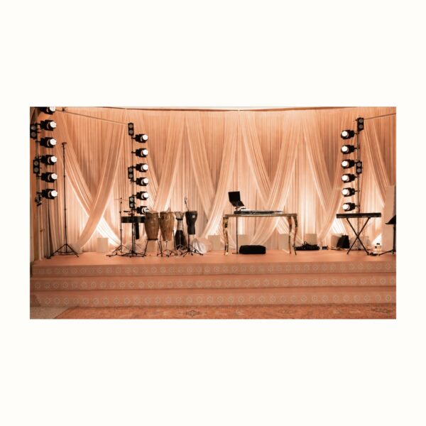 Criss cross drapery stage backdrop rental from Palace Party Rental