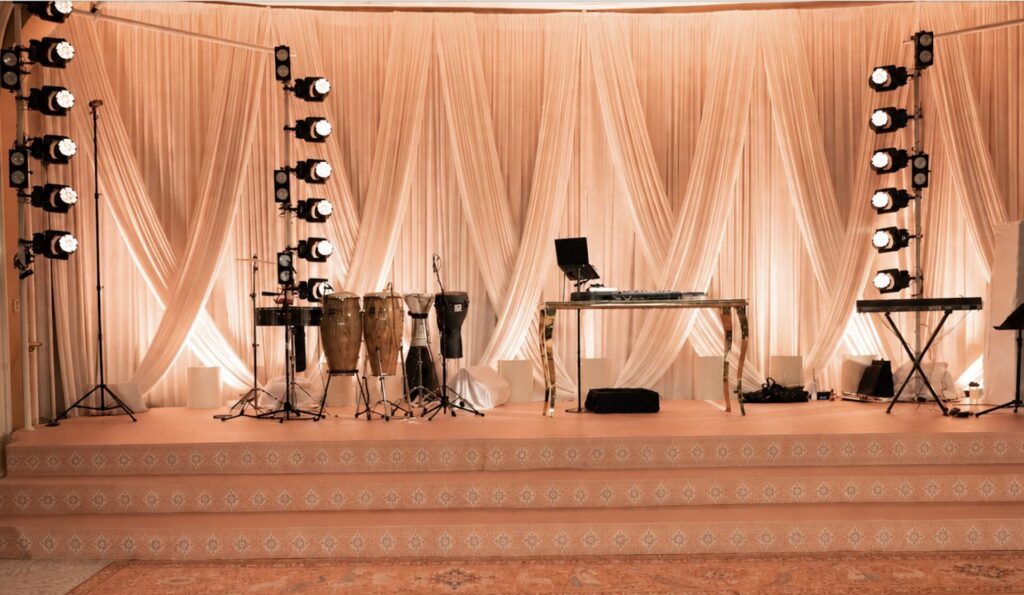 Criss cross drapery stage backdrop rental from Palace Party Rental